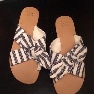 A new day sandals. Navy and off white striped pattern. Size 9